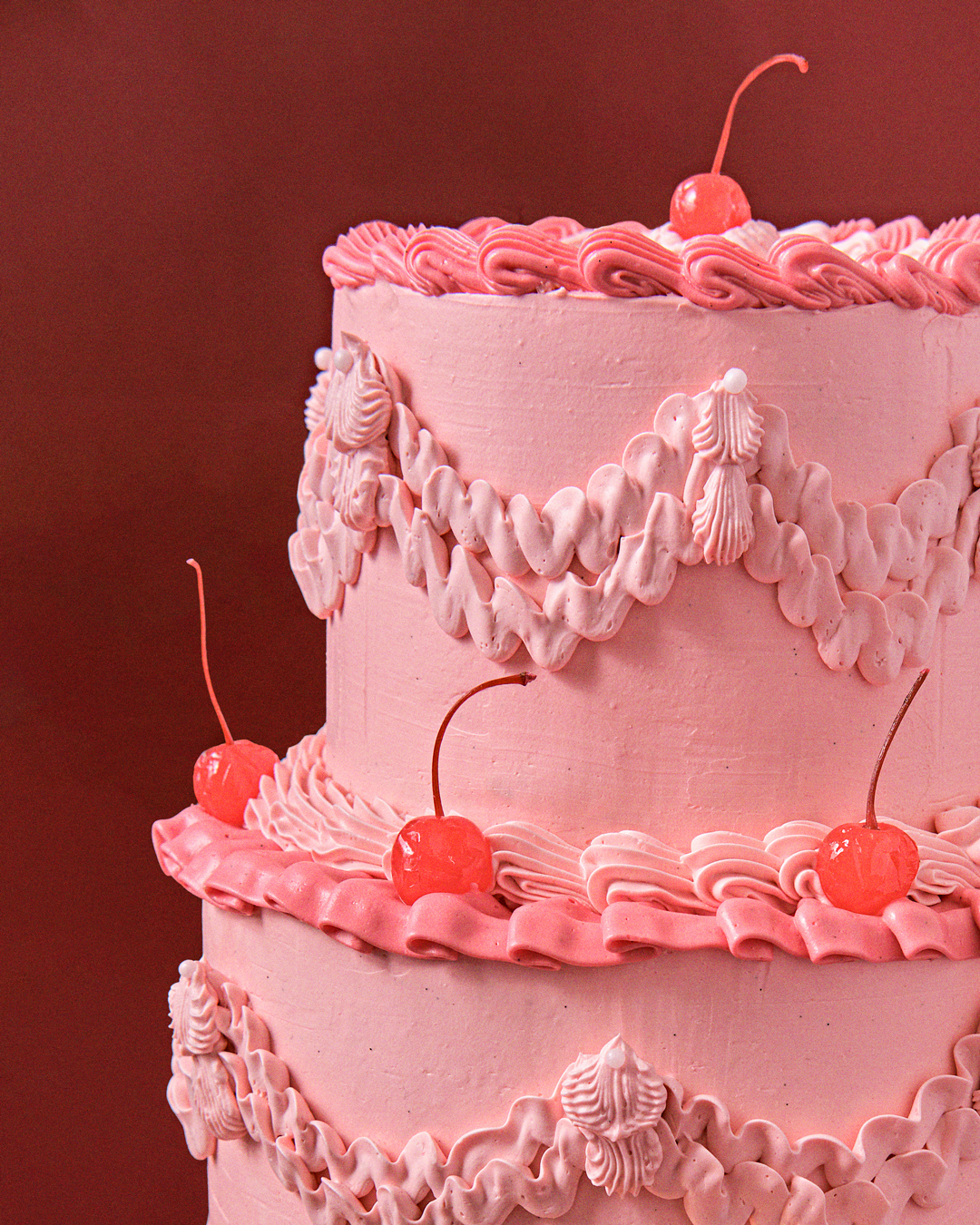 pink vintage tiered cake with cherries