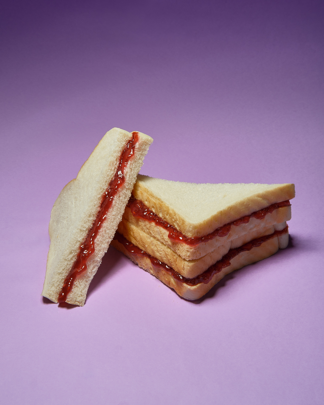 jam sandwich triangles on purple background